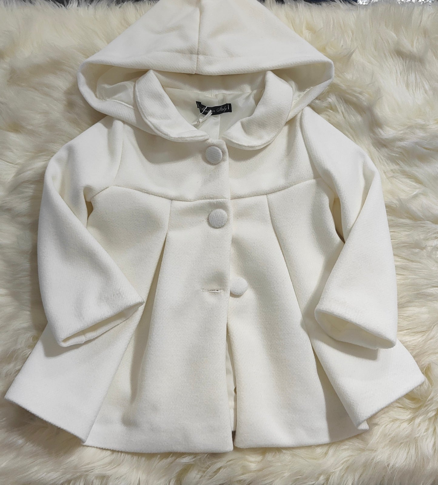 Cappotto bimba, in morbido tessuto colore panna, linea svasata, con cappuccio removibile